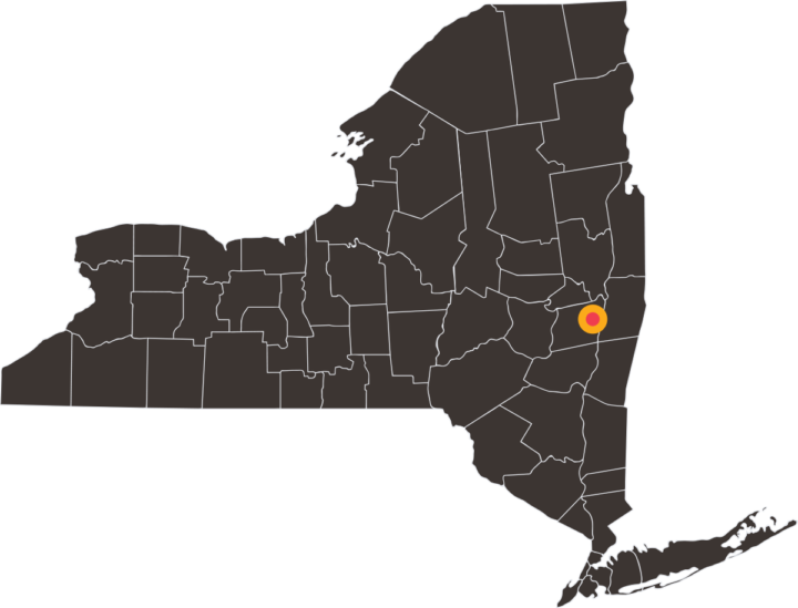 Map of New York with a yellow and red target on Albany