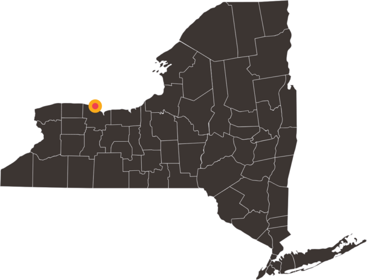 Map of New York with a yellow and red target on the city of Greece