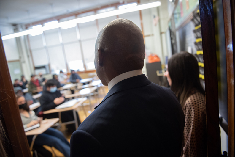 Mayor Eric Adams facing a school classroom