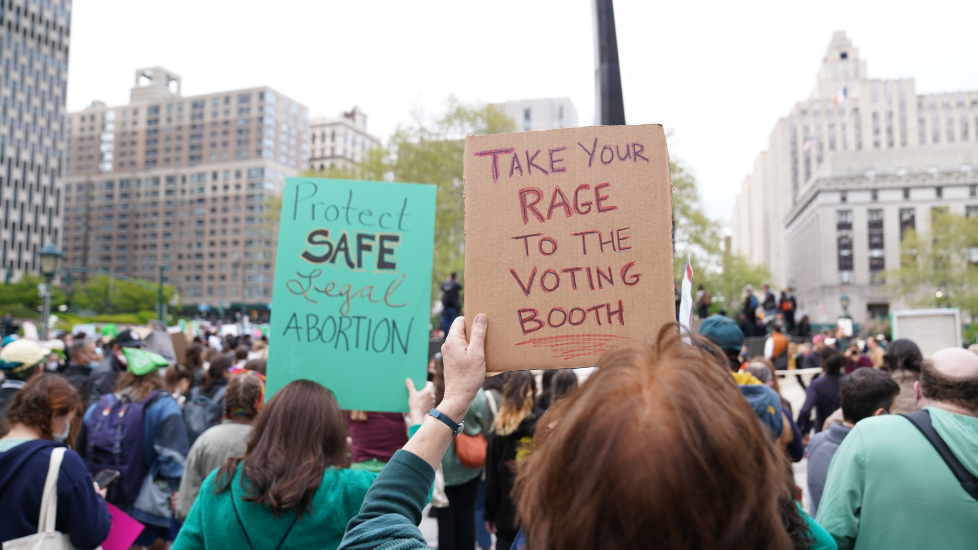 People holding signs at an abortion rights protest