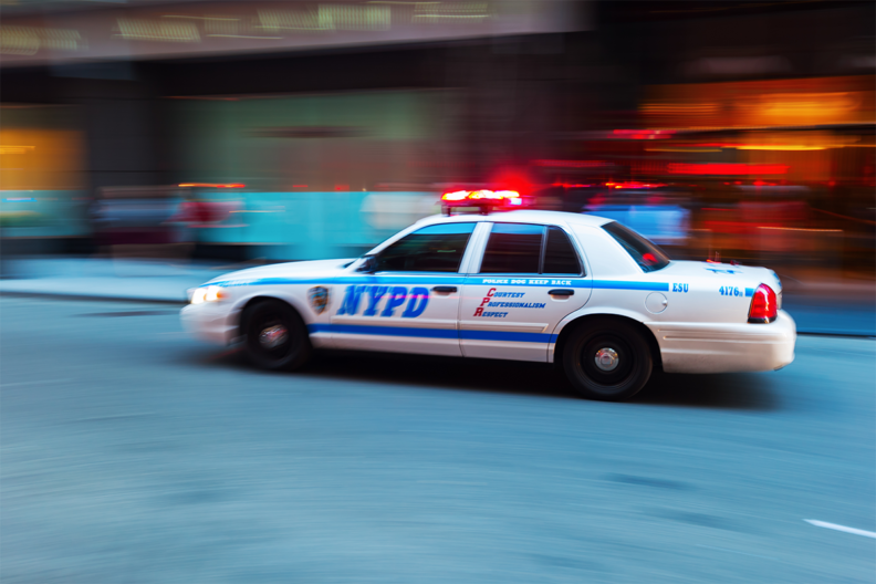 NYPD car with a blurry background