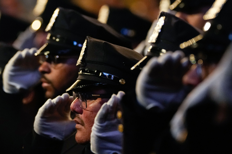 NYPD officers saluting